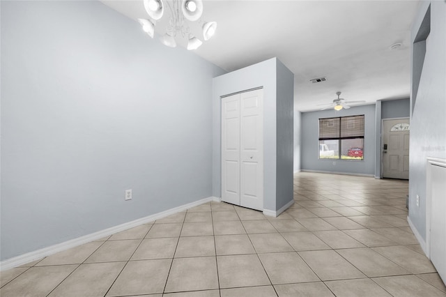 4415 SW 34th St Unit 107, Gainesville, FL 32608 - unfurnished dining area featuring light tile patterned floors, a ceiling fan, and a chandelier