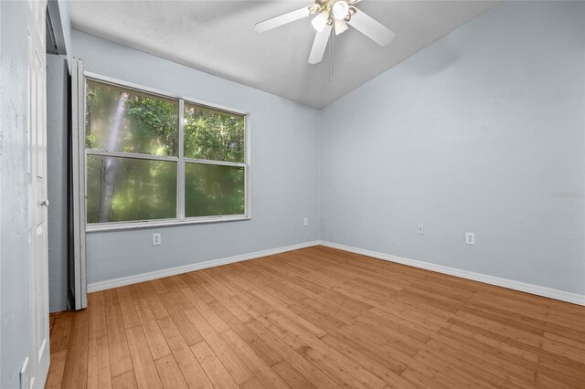 4415 SW 34th St Unit 107, Gainesville, FL 32608 - empty room with wood finished floors, vaulted ceiling, and ceiling fan