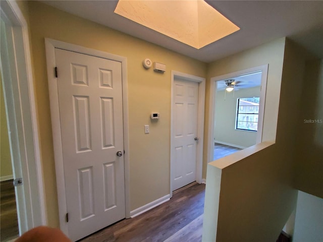 2207 SW 39th Dr, Gainesville, FL 32607 - corridor featuring dark wood finished floors and baseboards