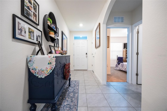 216 Hickory Crse, Ocala, FL 34472 - corridor featuring arched walkways and light tile patterned floors