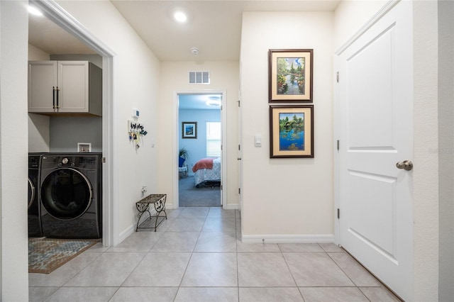 216 Hickory Crse, Ocala, FL 34472 - laundry room with washer / clothes dryer, cabinet space, and light tile patterned floors