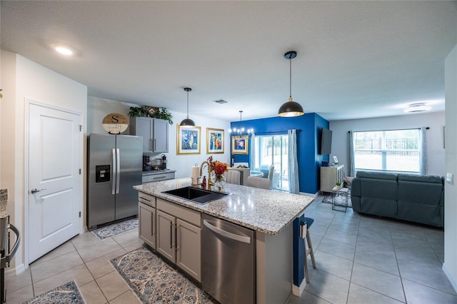 216 Hickory Crse, Ocala, FL 34472 - kitchen featuring appliances with stainless steel finishes, open floor plan, light tile patterned floors, and healthy amount of natural light