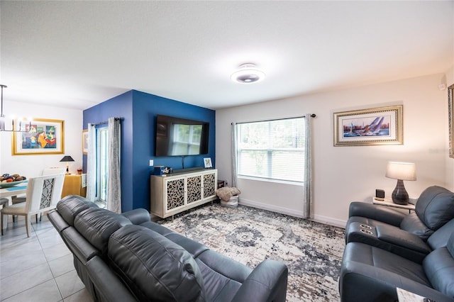 216 Hickory Crse, Ocala, FL 34472 - living room featuring a chandelier and baseboards