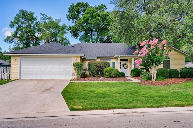 6618 SW 83rd Ter, Gainesville, FL 32608 - single story home featuring driveway, a garage, a front lawn, and roof with shingles
