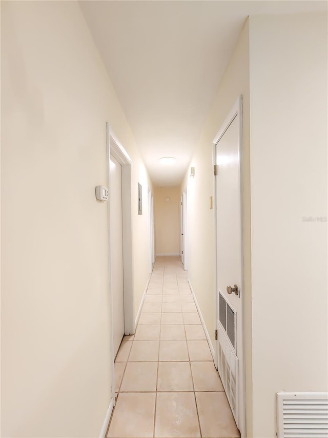 1601 NE 28th Ave, Gainesville, FL 32609 - hall with light tile patterned floors and baseboards