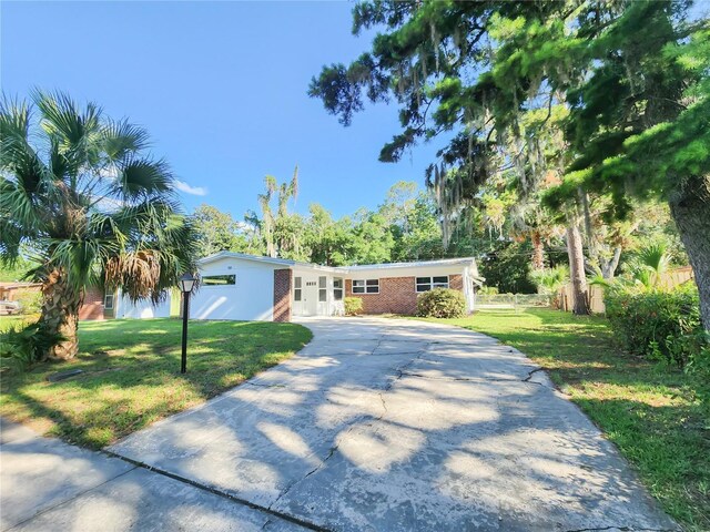 1601 NE 28th Ave, Gainesville, FL 32609 - view of front of property with concrete driveway and brick siding