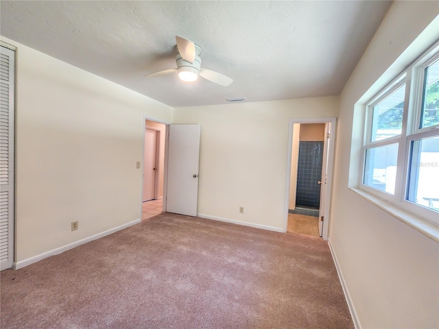 1601 NE 28th Ave, Gainesville, FL 32609 - unfurnished bedroom featuring light carpet and ceiling fan