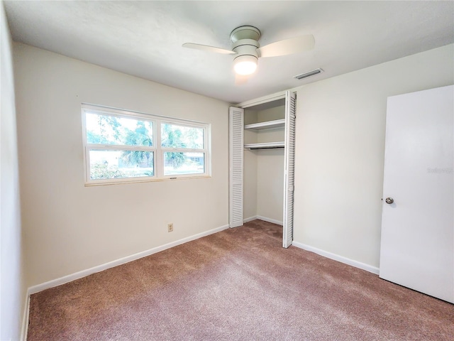 1601 NE 28th Ave, Gainesville, FL 32609 - unfurnished bedroom featuring carpet, a closet, and ceiling fan
