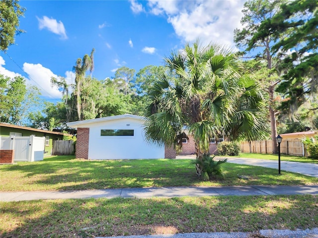 1601 NE 28th Ave, Gainesville, FL 32609 - view of front of property featuring brick siding and a gate