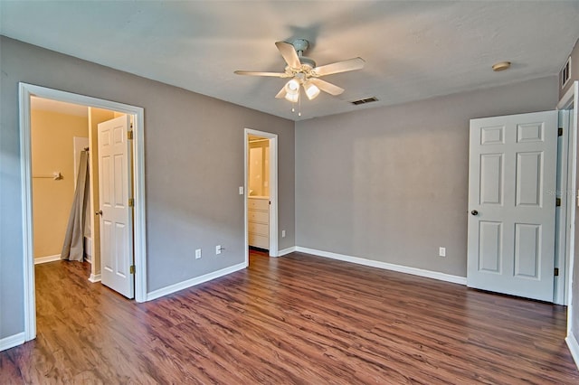 3701 NW 26th St, Gainesville, FL 32605 - unfurnished bedroom with dark wood-style floors and ceiling fan