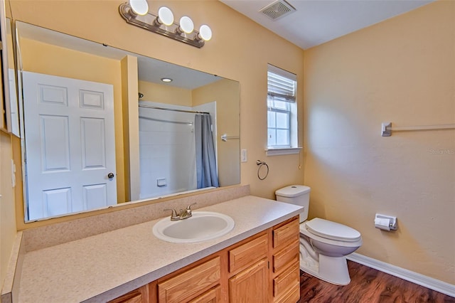 3701 NW 26th St, Gainesville, FL 32605 - bathroom featuring wood finished floors, vanity, and curtained shower
