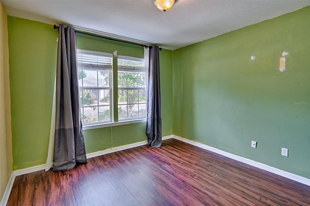 3701 NW 26th St, Gainesville, FL 32605 - empty room featuring wood finished floors and baseboards