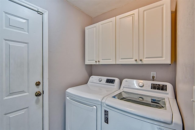 3701 NW 26th St, Gainesville, FL 32605 - laundry area featuring cabinet space and separate washer and dryer