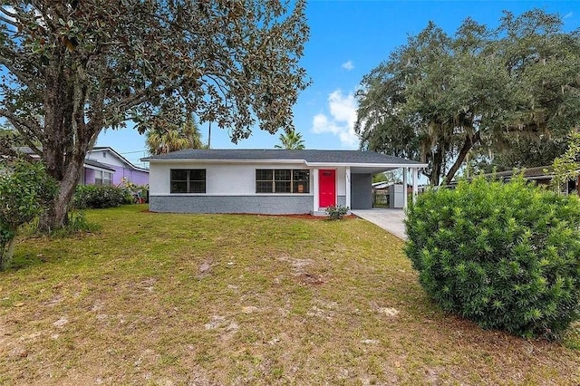 1510 SE 14th Ave, Gainesville, FL 32641 - view of front facade featuring a front lawn, a carport, and concrete driveway