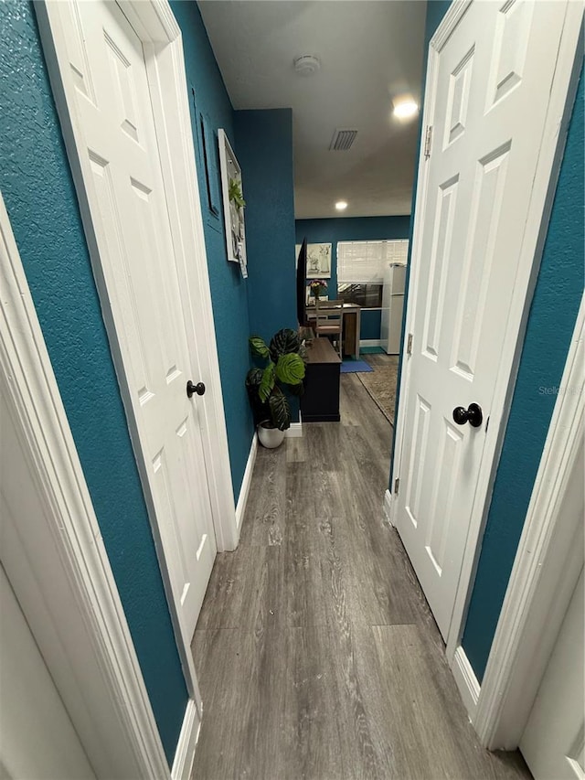 1510 SE 14th Ave, Gainesville, FL 32641 - corridor featuring dark wood finished floors and baseboards