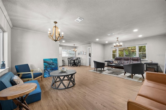4923 SW Ichetucknee Ave, Fort White, FL 32038 - living area with a chandelier, a textured ceiling, light wood finished floors, recessed lighting, and healthy amount of natural light