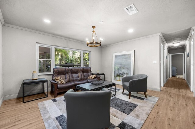 4923 SW Ichetucknee Ave, Fort White, FL 32038 - living room featuring crown molding, a chandelier, light wood-type flooring, recessed lighting, and a textured ceiling