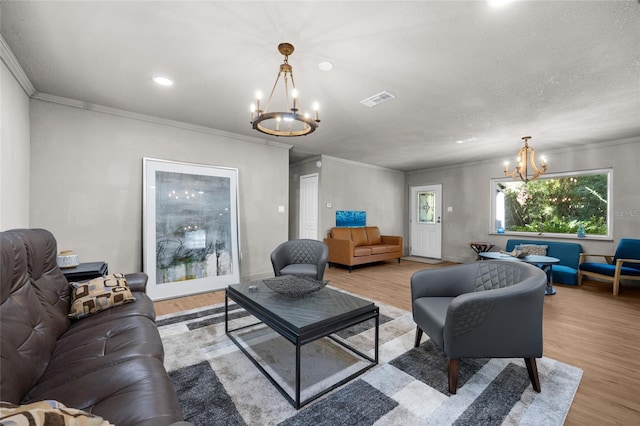 4923 SW Ichetucknee Ave, Fort White, FL 32038 - living room featuring a chandelier, light wood-style floors, crown molding, and recessed lighting
