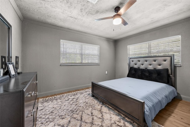4923 SW Ichetucknee Ave, Fort White, FL 32038 - bedroom with wood finished floors, crown molding, a textured ceiling, and a ceiling fan