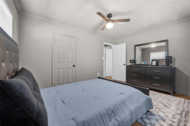 4923 SW Ichetucknee Ave, Fort White, FL 32038 - bedroom with wood finished floors, ornamental molding, and a ceiling fan