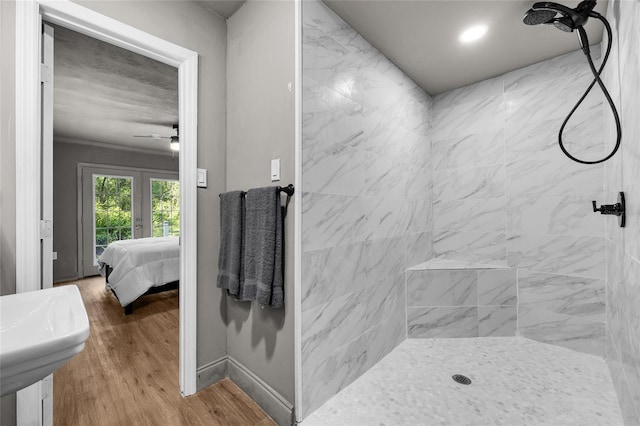 4923 SW Ichetucknee Ave, Fort White, FL 32038 - full bathroom featuring tiled shower, ensuite bath, wood finished floors, and a ceiling fan
