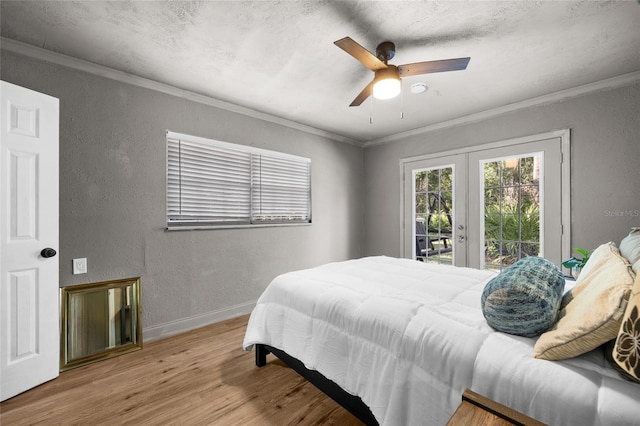 4923 SW Ichetucknee Ave, Fort White, FL 32038 - bedroom featuring access to outside, wood finished floors, french doors, a textured wall, and crown molding