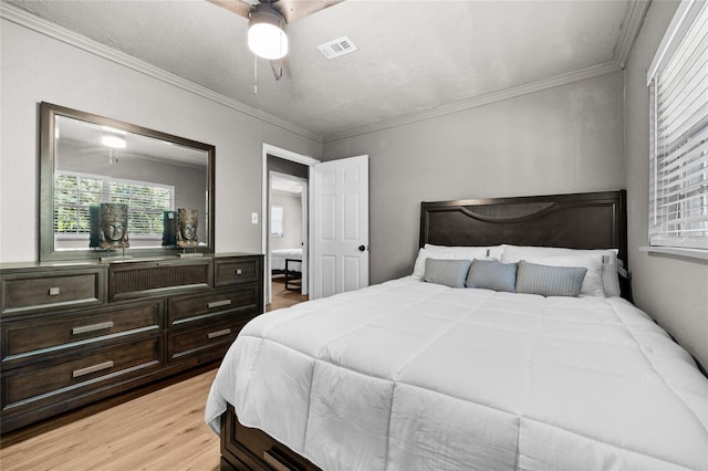 4923 SW Ichetucknee Ave, Fort White, FL 32038 - bedroom featuring light wood-style flooring, ornamental molding, and a ceiling fan