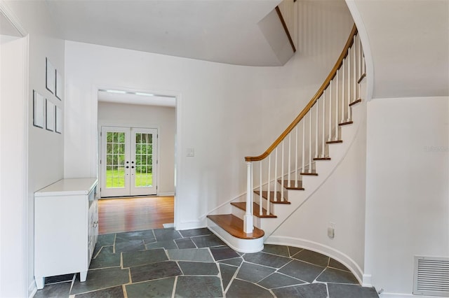 2506 SW 9th Dr, Gainesville, FL 32601 - foyer with stairway, french doors, and dark stone finish floors