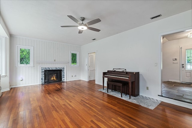 2506 SW 9th Dr, Gainesville, FL 32601 - living room featuring ceiling fan, wood-type flooring, and a tile fireplace