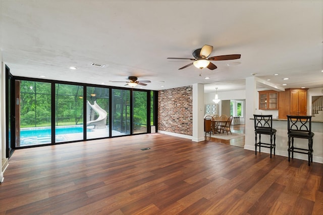 2506 SW 9th Dr, Gainesville, FL 32601 - living area with wood finished floors, a ceiling fan, and recessed lighting