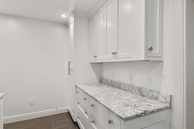 2506 SW 9th Dr, Gainesville, FL 32601 - kitchen featuring white cabinetry, recessed lighting, and light stone counters