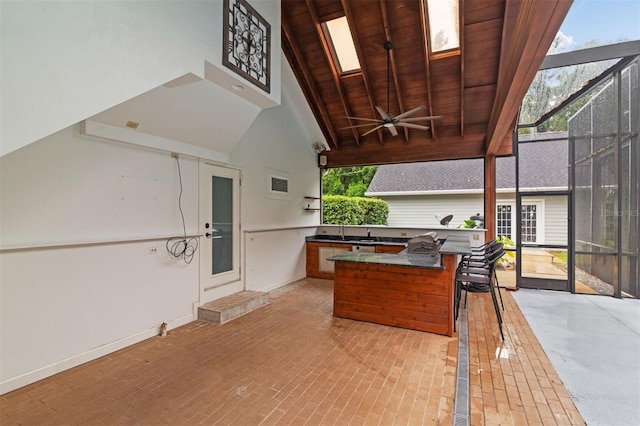 2506 SW 9th Dr, Gainesville, FL 32601 - view of patio featuring exterior kitchen, a ceiling fan, and a lanai