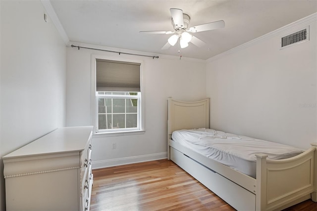 2506 SW 9th Dr, Gainesville, FL 32601 - bedroom with light wood-style floors, crown molding, and ceiling fan