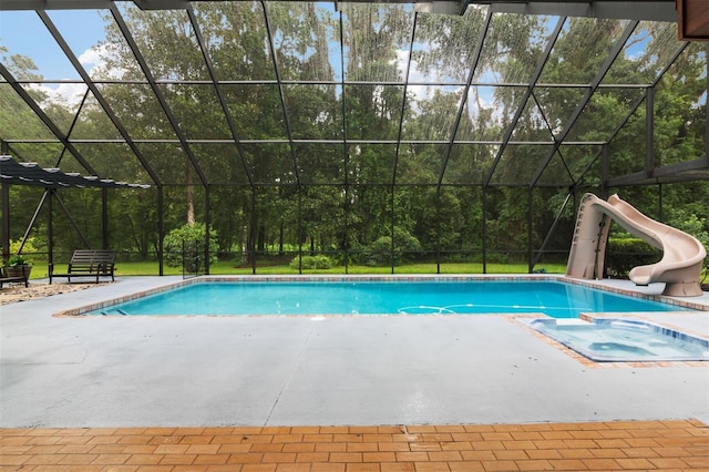 2506 SW 9th Dr, Gainesville, FL 32601 - view of pool with a water slide, a patio, a pool with connected hot tub, and glass enclosure