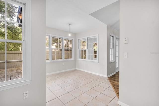 5328 SW 88th Ct, Gainesville, FL 32608 - unfurnished dining area with plenty of natural light and light tile patterned floors