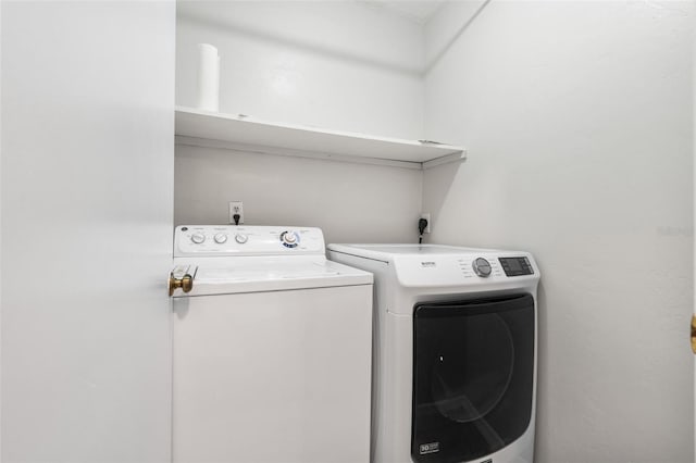 5328 SW 88th Ct, Gainesville, FL 32608 - laundry area featuring washer and clothes dryer