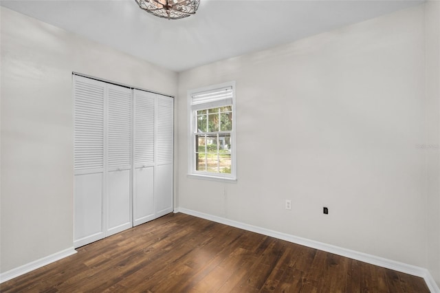 5328 SW 88th Ct, Gainesville, FL 32608 - unfurnished bedroom featuring dark wood-type flooring and a closet