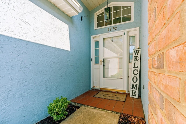 3292 NE 42nd Pl, Ocala, FL 34479 - doorway to property with stucco siding