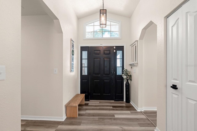 3292 NE 42nd Pl, Ocala, FL 34479 - entrance foyer with vaulted ceiling, arched walkways, and light wood finished floors