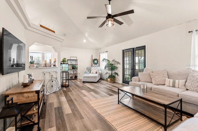 3292 NE 42nd Pl, Ocala, FL 34479 - living area featuring vaulted ceiling, plenty of natural light, a ceiling fan, and wood finished floors