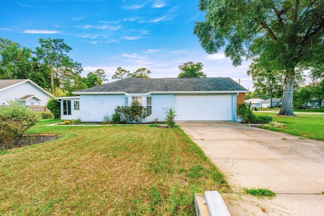 3292 NE 42nd Pl, Ocala, FL 34479 - view of front facade featuring an attached garage, driveway, a front yard, and stucco siding