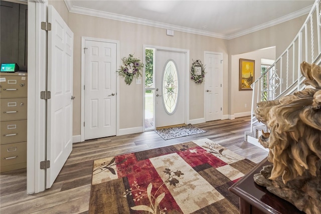 174 SW Dalmation Ln, Lake City, FL 32024 - foyer featuring stairs, wood finished floors, and ornamental molding