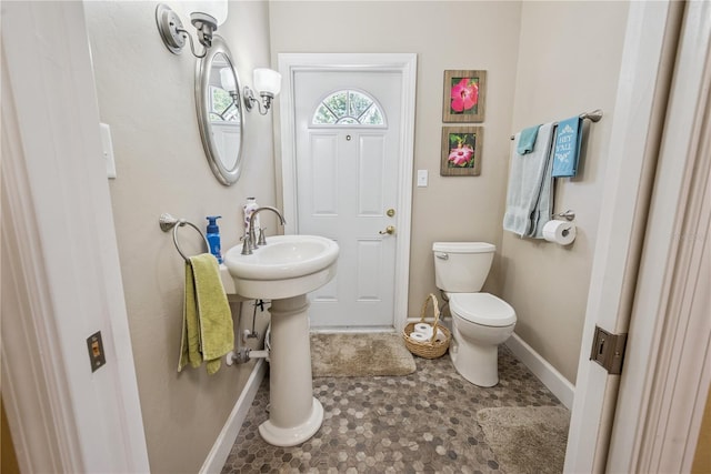 174 SW Dalmation Ln, Lake City, FL 32024 - half bathroom with baseboards and toilet