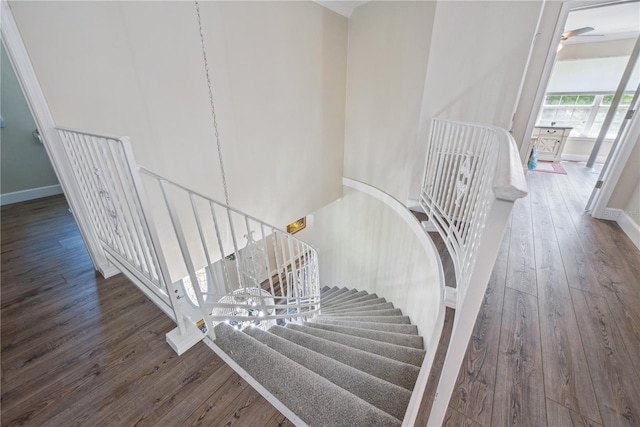 174 SW Dalmation Ln, Lake City, FL 32024 - staircase featuring hardwood / wood-style floors and baseboards