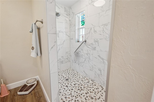 174 SW Dalmation Ln, Lake City, FL 32024 - bathroom with a tile shower and baseboards