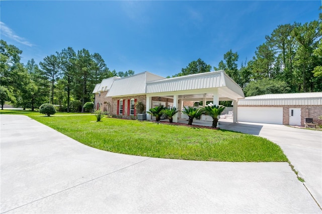 174 SW Dalmation Ln, Lake City, FL 32024 - view of front facade with a front yard and a garage
