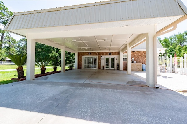 174 SW Dalmation Ln, Lake City, FL 32024 - view of patio featuring french doors and concrete driveway