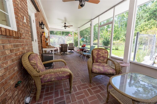 174 SW Dalmation Ln, Lake City, FL 32024 - sunroom featuring a ceiling fan and outdoor dining area