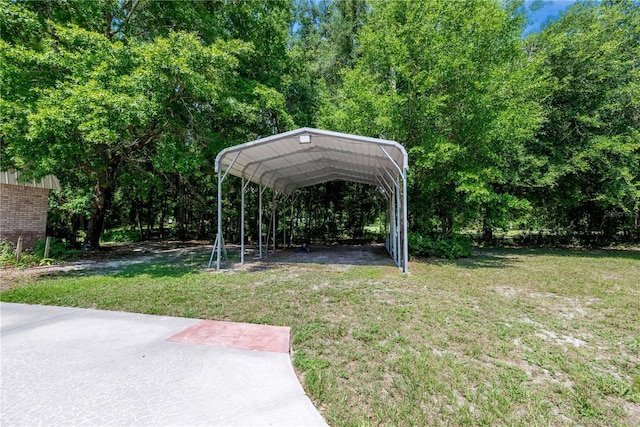 174 SW Dalmation Ln, Lake City, FL 32024 - view of green lawn with a detached carport