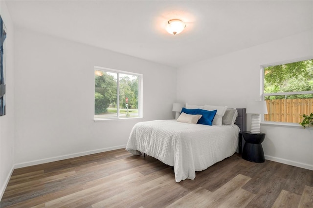 1604 NE 7th St, Gainesville, FL 32609 - bedroom featuring wood finished floors and baseboards